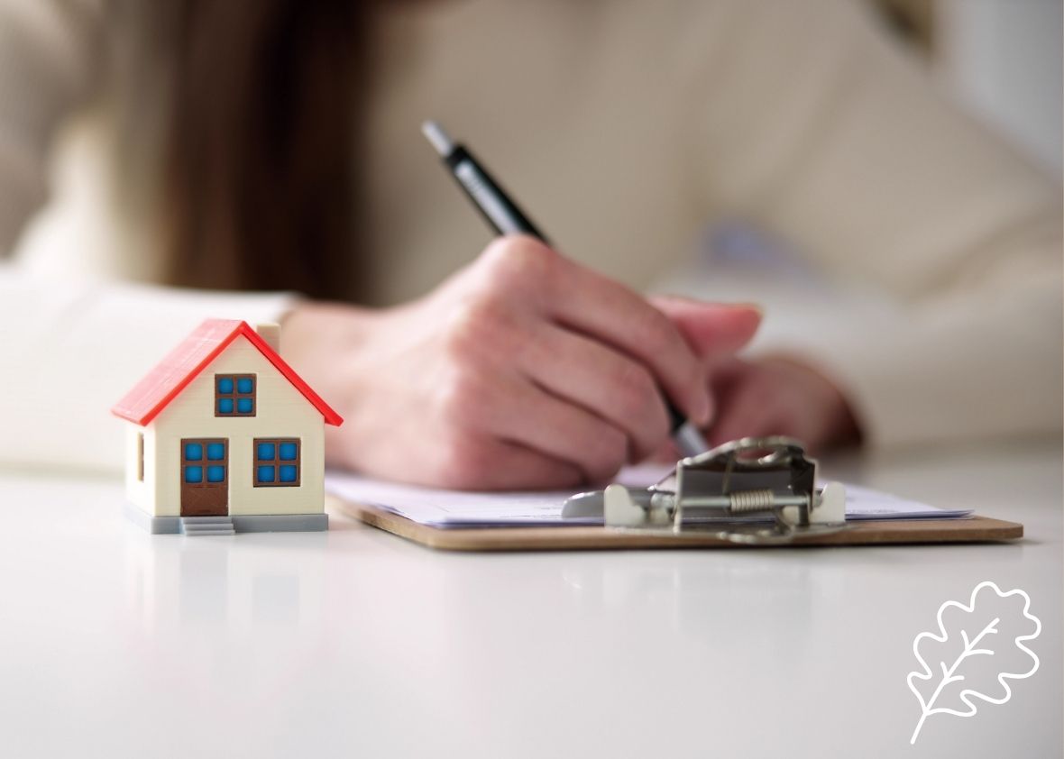 Oaktree Will Services – LPAs – Financial and Property Image of hand writing a document with a house